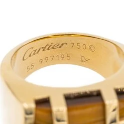 Bague CARTIER, "Yjing",en Or Jaune Et Œil De Tigre -Castafiore Boutique bague cartier yjing en or jaune et oeil de tigre 366941