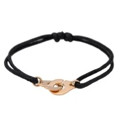 Bracelet DINH VAN "Menottes R12" En Or Rose Sur Cordon